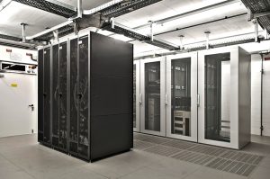 air conditioned it server room with black and grey cupboards with huge computers and network equipment